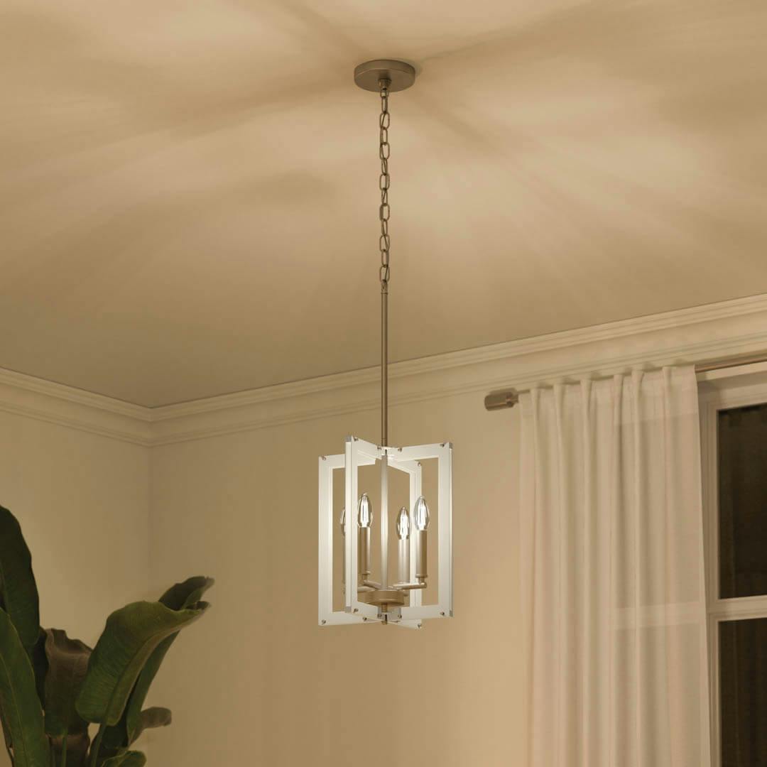 Night time living room with Pendroy 12" 4 light Pendant Brushed Nickel