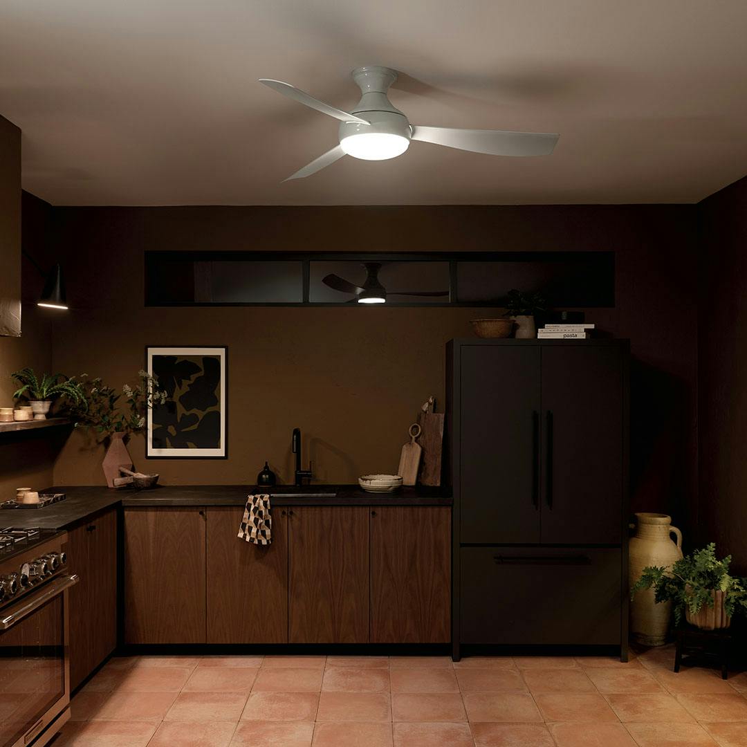 Kitchen at night with the 54 Inch Ample Ceiling Fan with Satin Etched Cased Opal Glass in White with White Blades