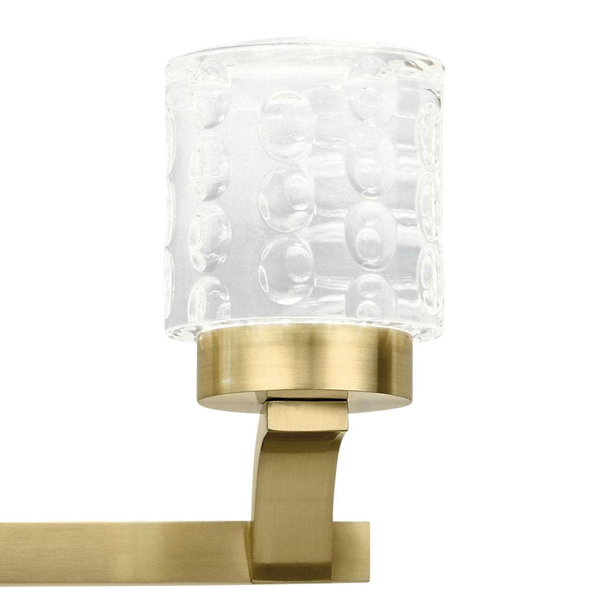 Close up view of the Rene 3000K LED 3 Light Bath Light in Gold on a white background