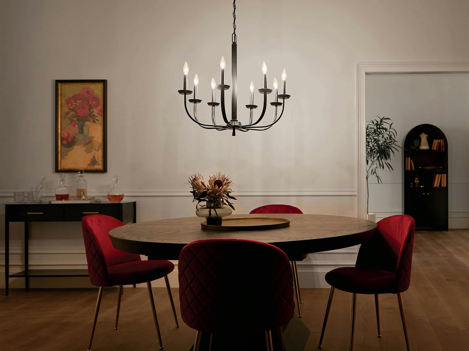 Kennewick chandelier shining in a dimly lit dining room