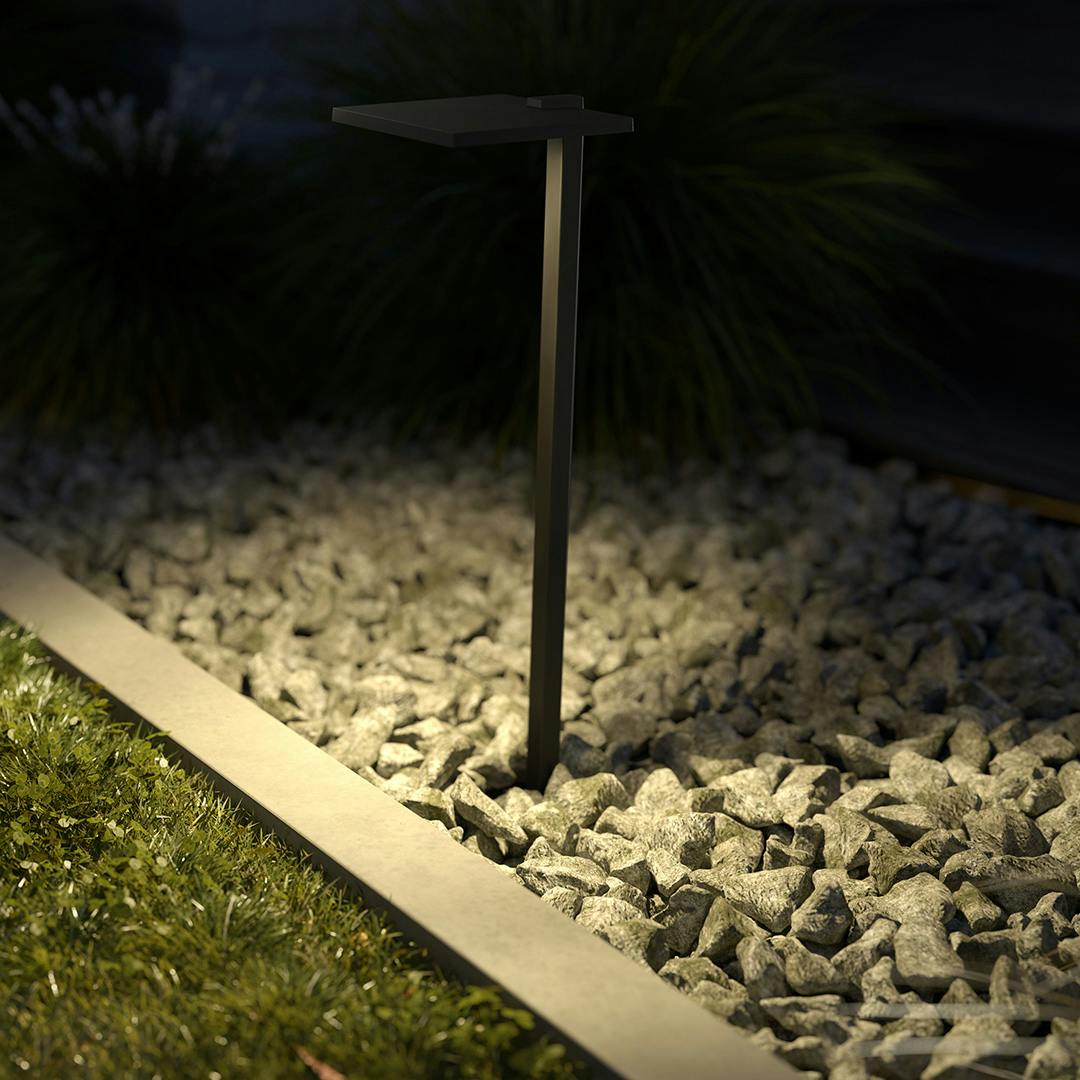 The 12 Volt 3000K LED 6" Shallow Shade Path Light in Textured Black outside at night