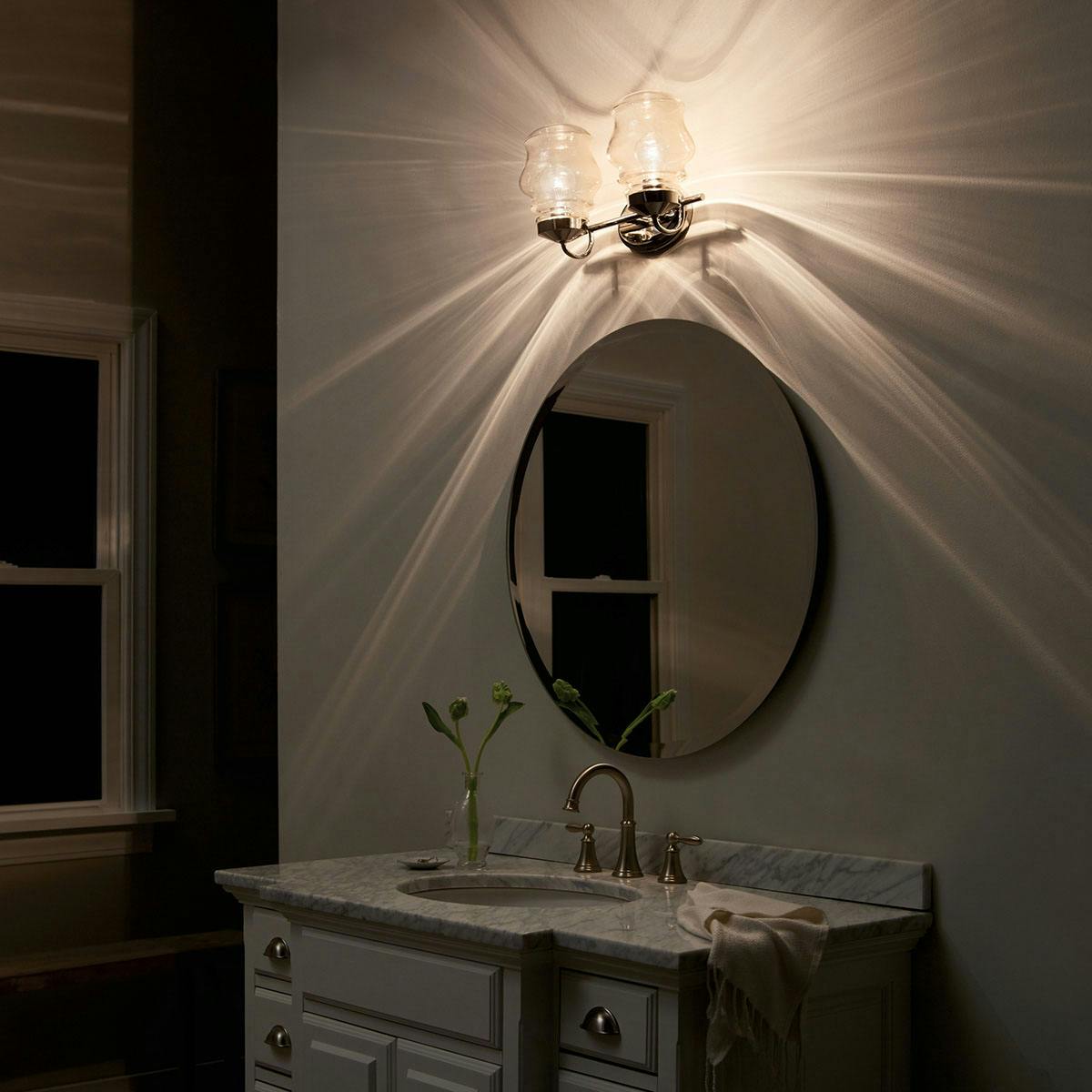 Night time Bathroom featuring Janiel vanity light 55038PN