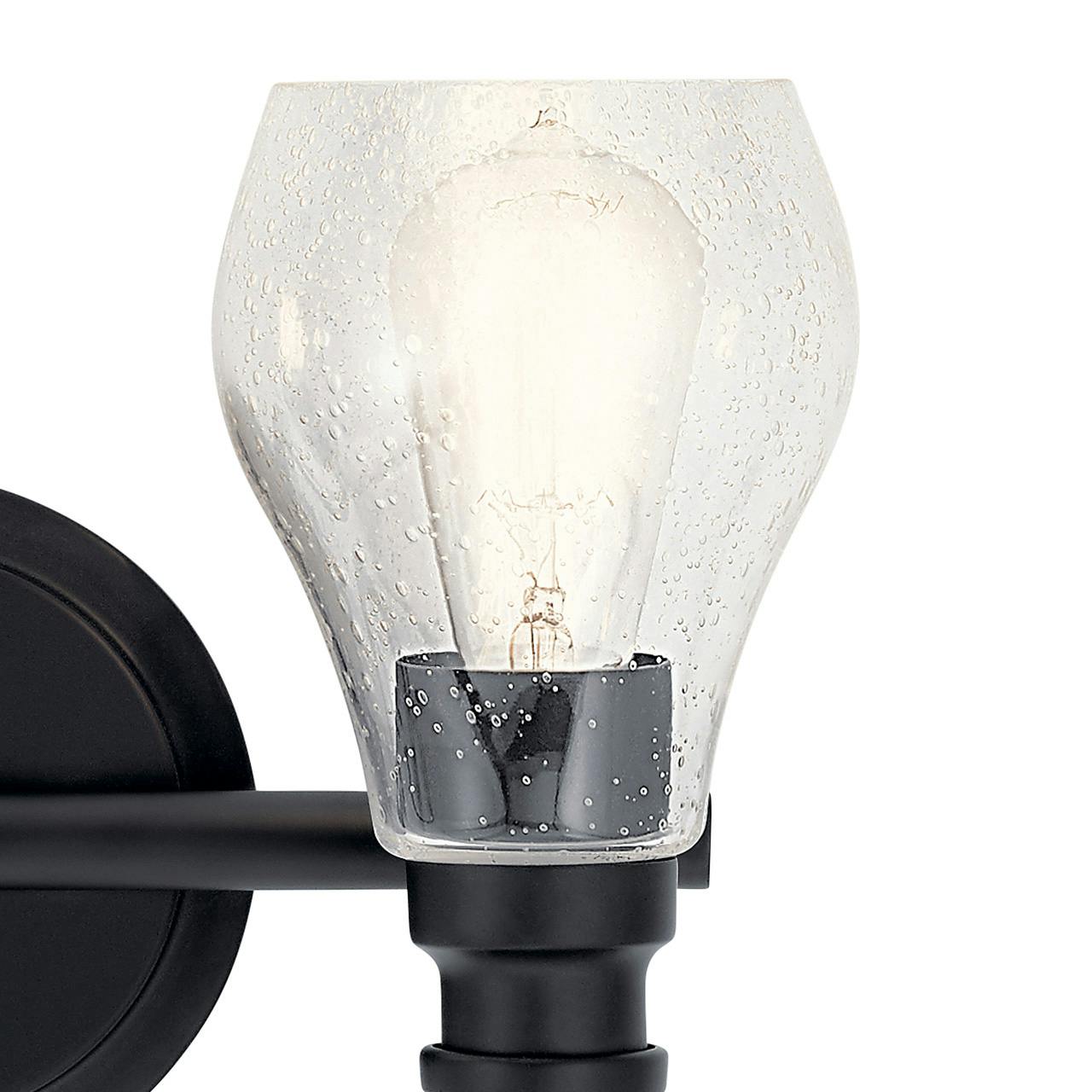 Close up view of the Greenbrier™ 2 Light Vanity Light Black on a white background