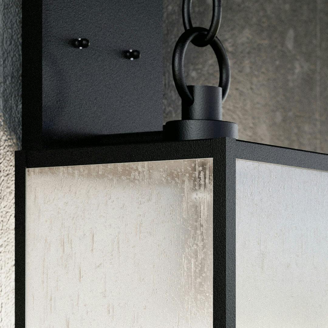 Patio in day light with the Lahden 26" 3 Light Outdoor Wall Light with Clear Seeded Glass in Textured Black