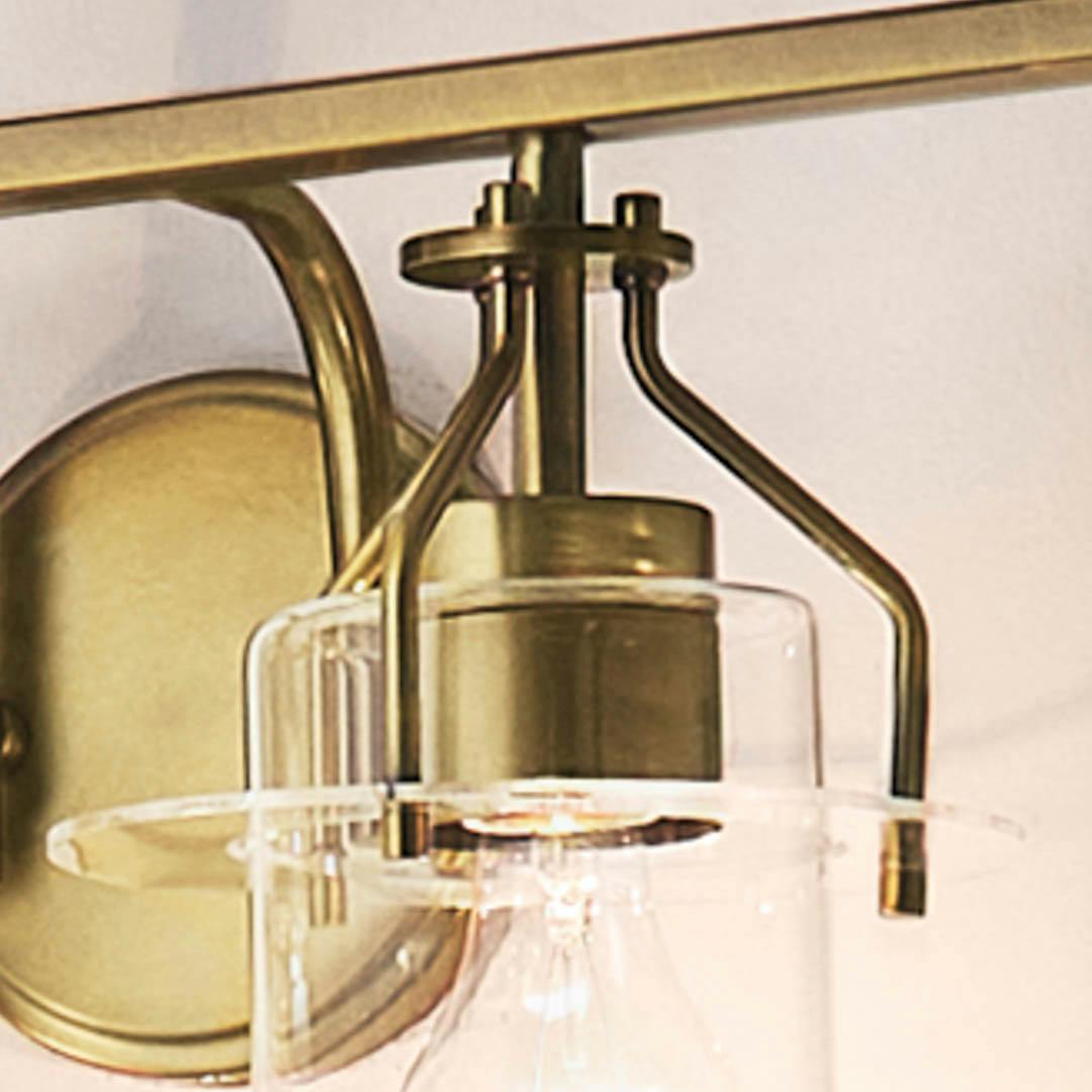 Day time bathroom with Everett 34.25 Inch 4 Light Vanity Light with Clear Glass in Natural Brass