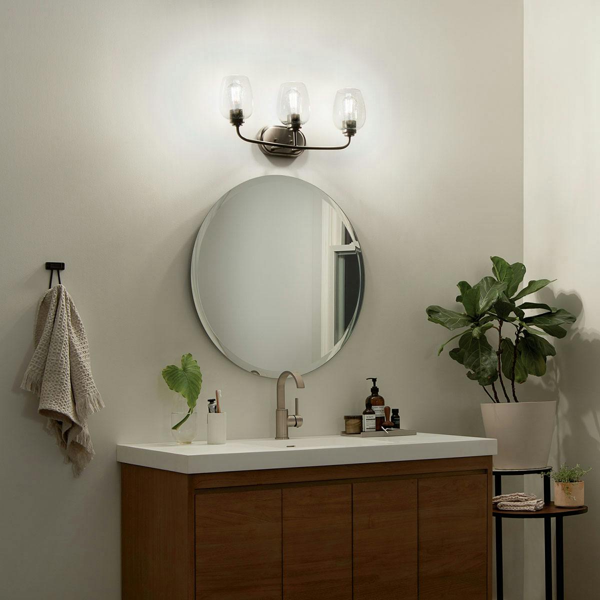 Night time bathroom image featuring Valserrano vanity light 45129NI