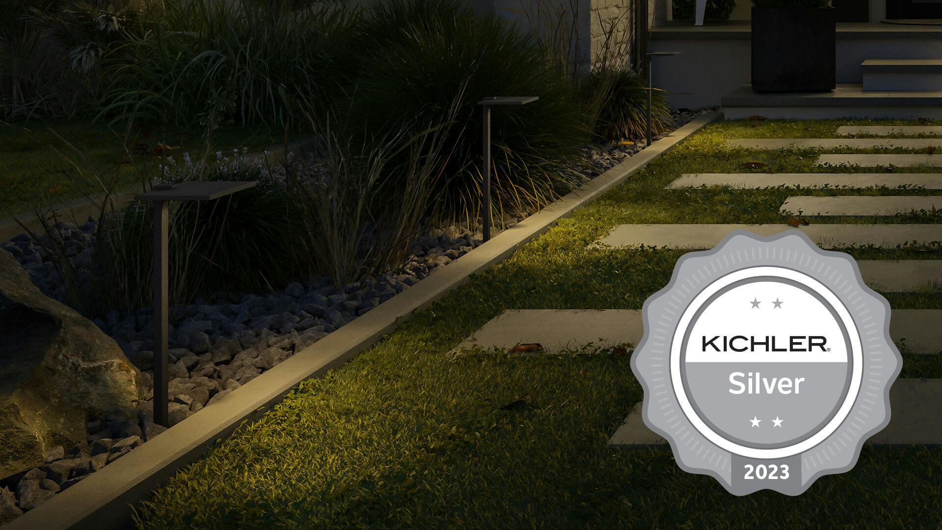 Evening garden pathway featuring a Kichler Silver 2023 medal