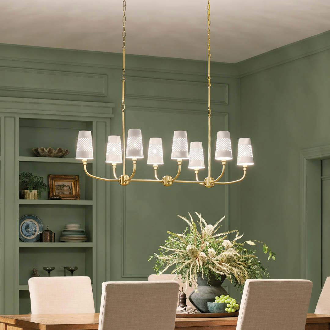 Day time dining room with Adeena 47.25" 8 Light Linear Chandelier Brushed Natural Brass