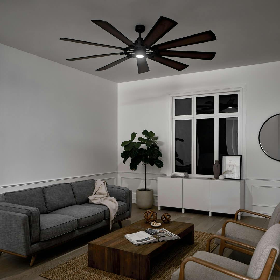 Night time living room with the Gentry LED 85" 9 Blade Fan Black