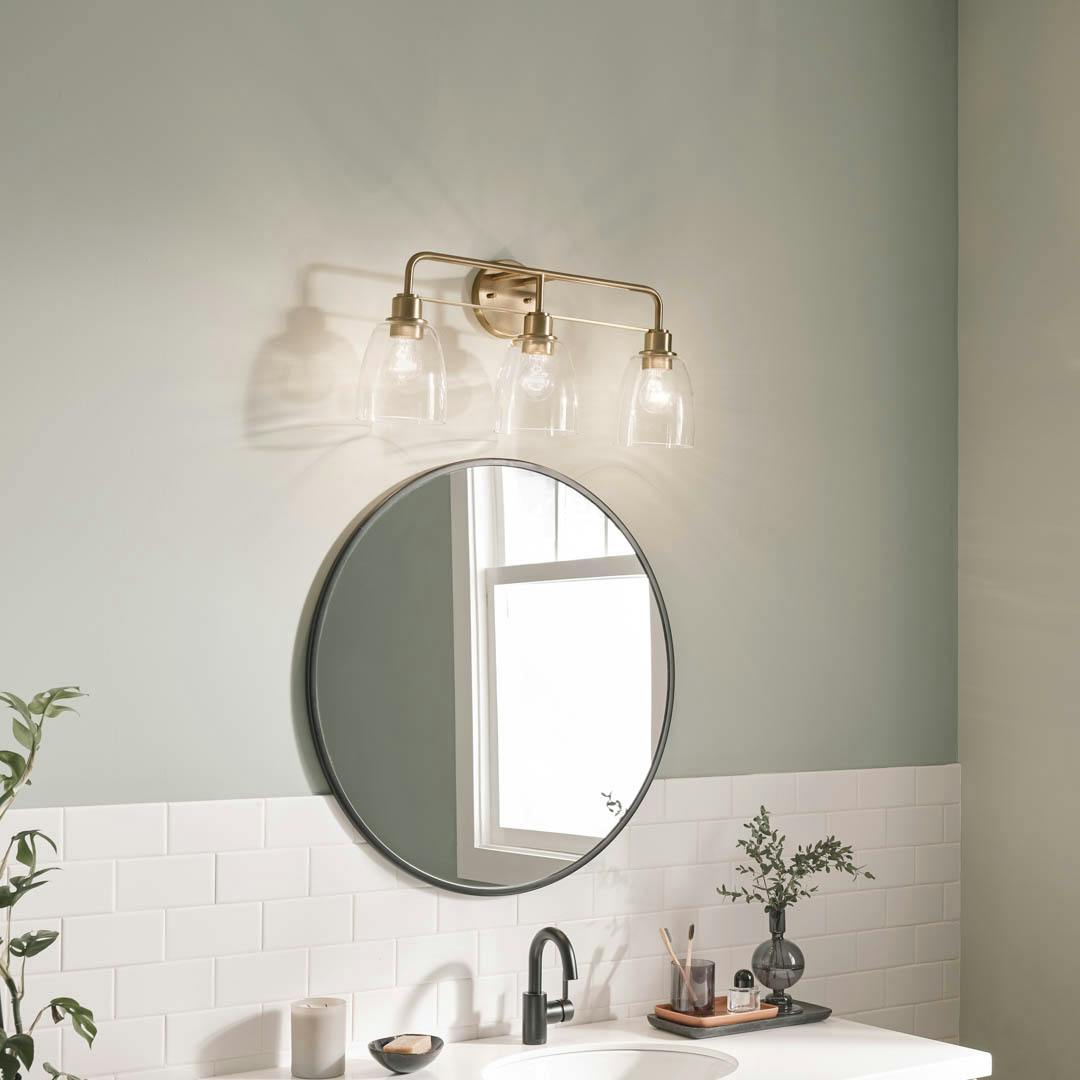 Day time bathroom with Meller 24.25 Inch 3 Light Vanity Light with Clear Glass in Champagne Bronze