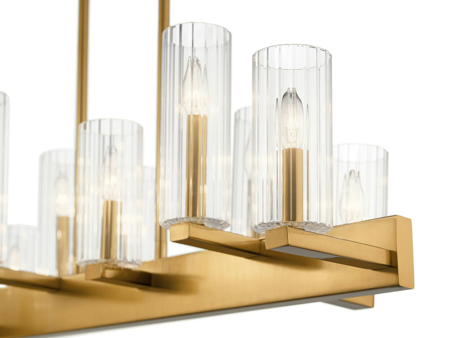 Close up view of the Cleara 10 Light Linear Chandelier Gold on a white background