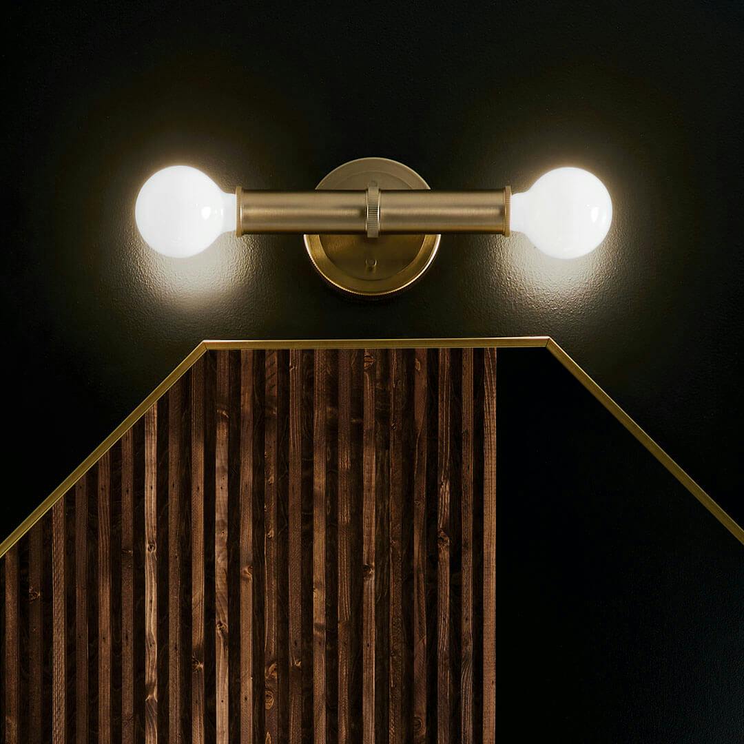 Night time bathroom with the Torche 9.75 Inch 2 Light Wall Sconce in Champagne Bronze