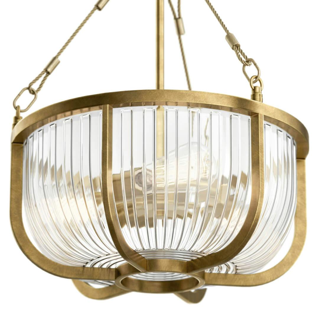 Close up the  Roux 22.25" 3 Light Pendant Natural Brass on a white background