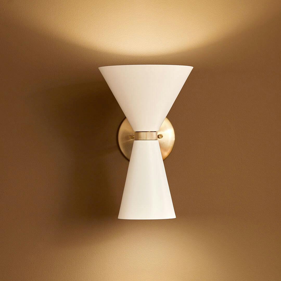 Day time living room with the Phix 13.5 Inch 2 Light Wall Sconce in Champagne Bronze with White