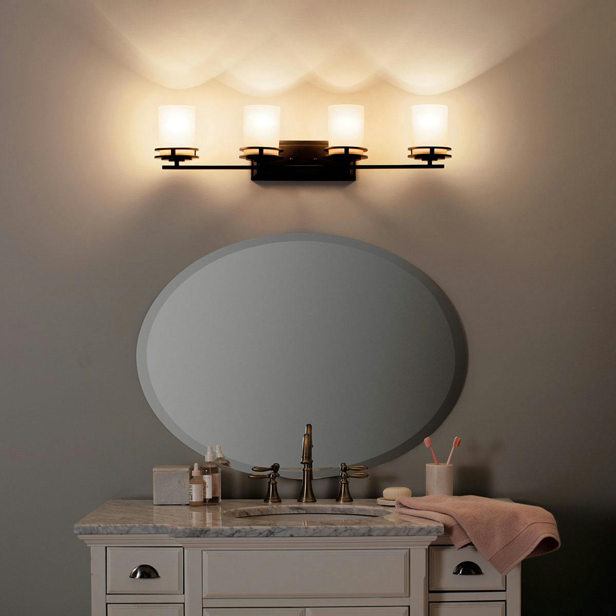 Night time Bathroom featuring Hendrik vanity light 5079OZ