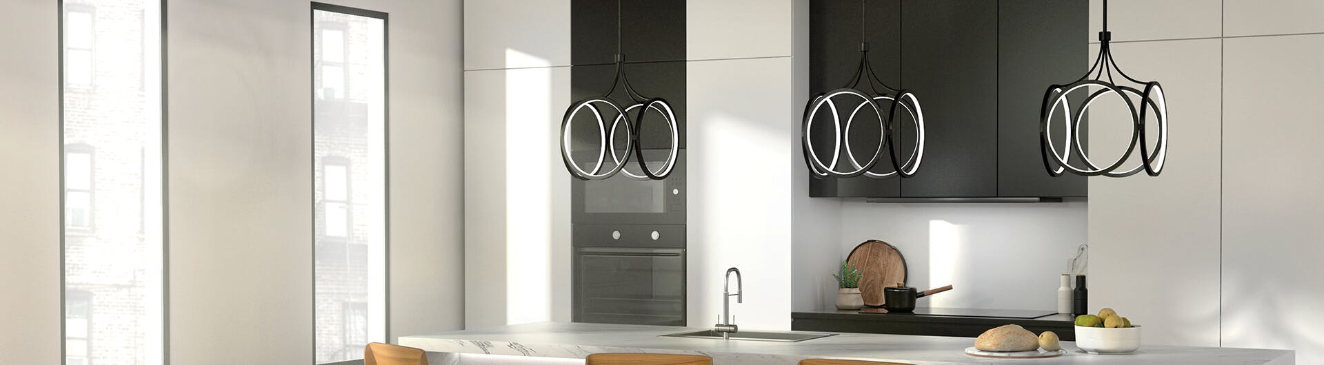 Kitchen in a high rise with three black finish ciri pendant lights hanging over a kitchen island