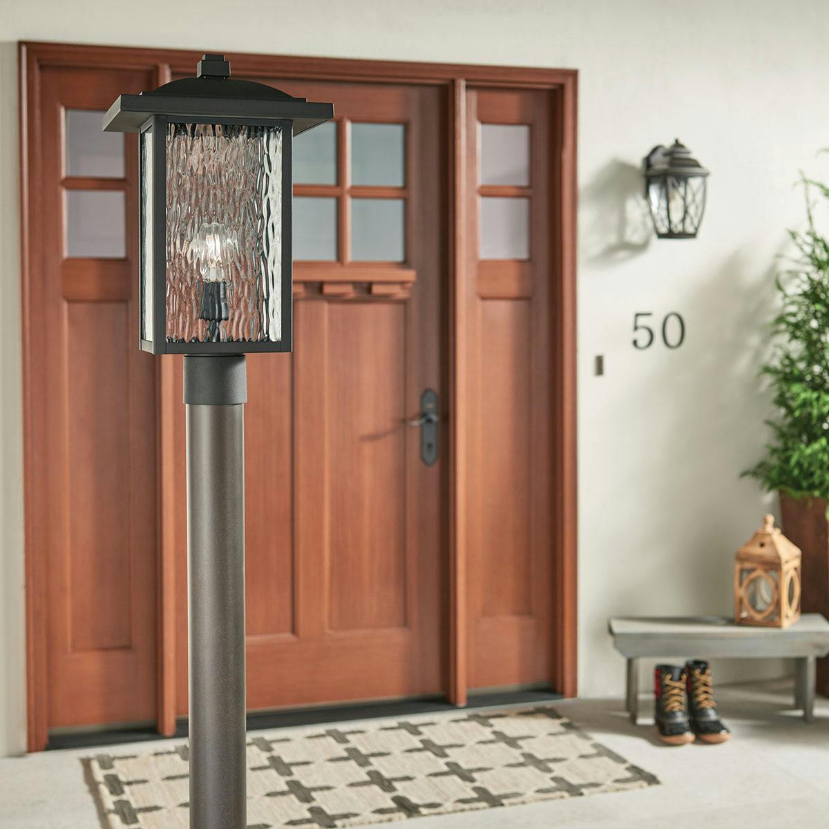 Day time Exterior image featuring Capanna outdoor post light 49927BKT
