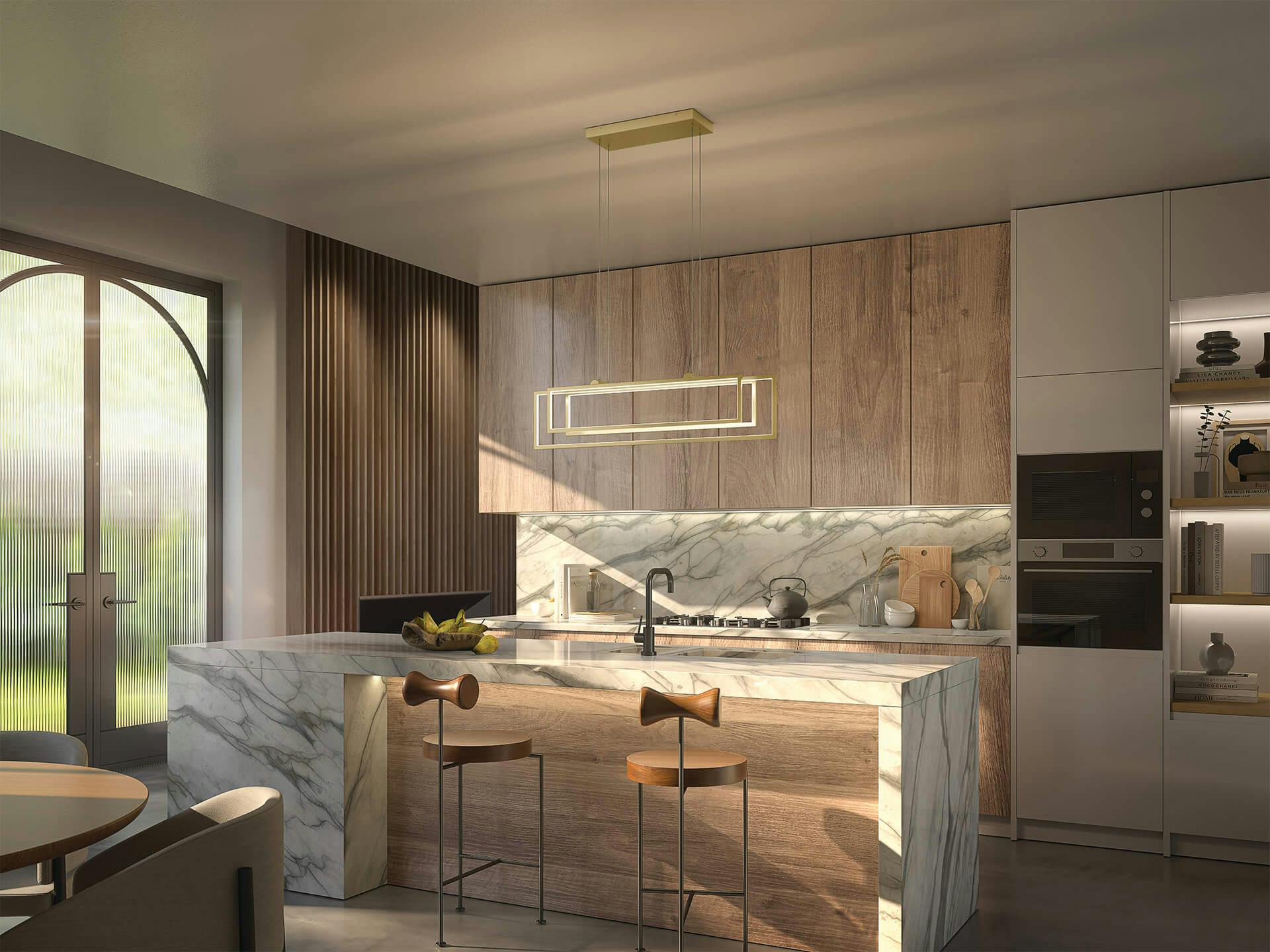 Modern marble and wood paneled kitchen featuring Jestin chandelier above kitchen island