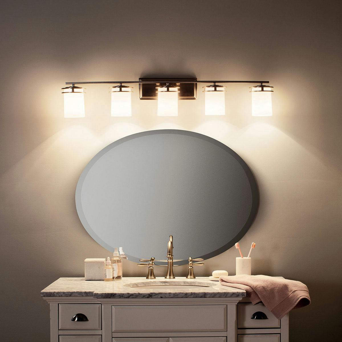 Night time Bathroom featuring Hendrick vanity light 5085NI