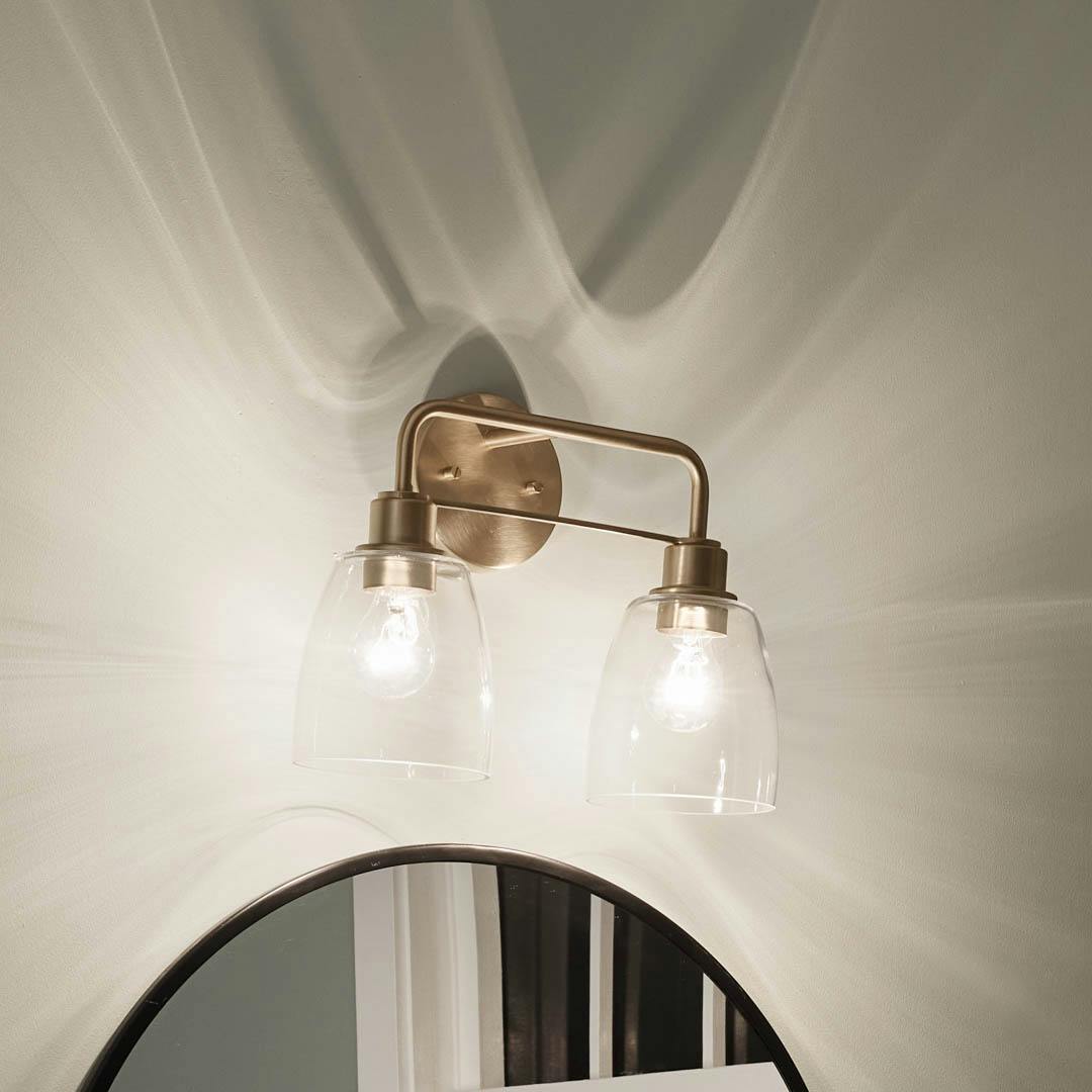 Night time bathroom with Meller 15.25 Inch 2 Light Vanity Light with Clear Glass in Champagne Bronze