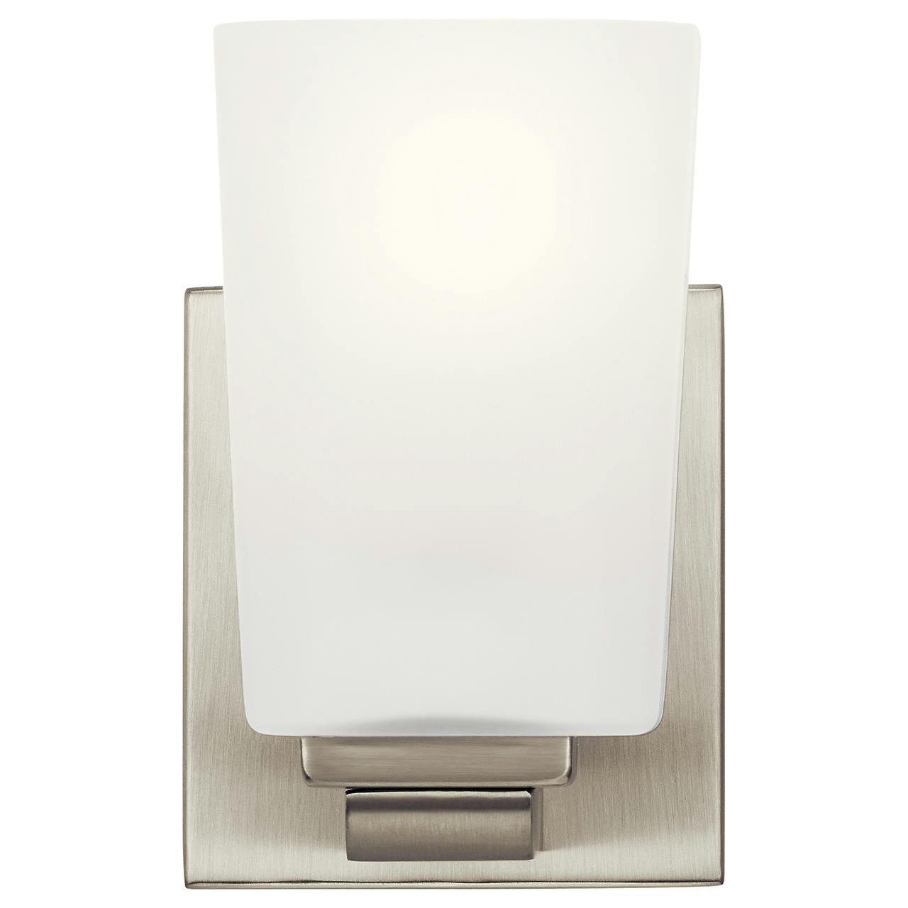 The Roehm™ 1 Light Wall Sconce Brushed Nickel facing up on a white background