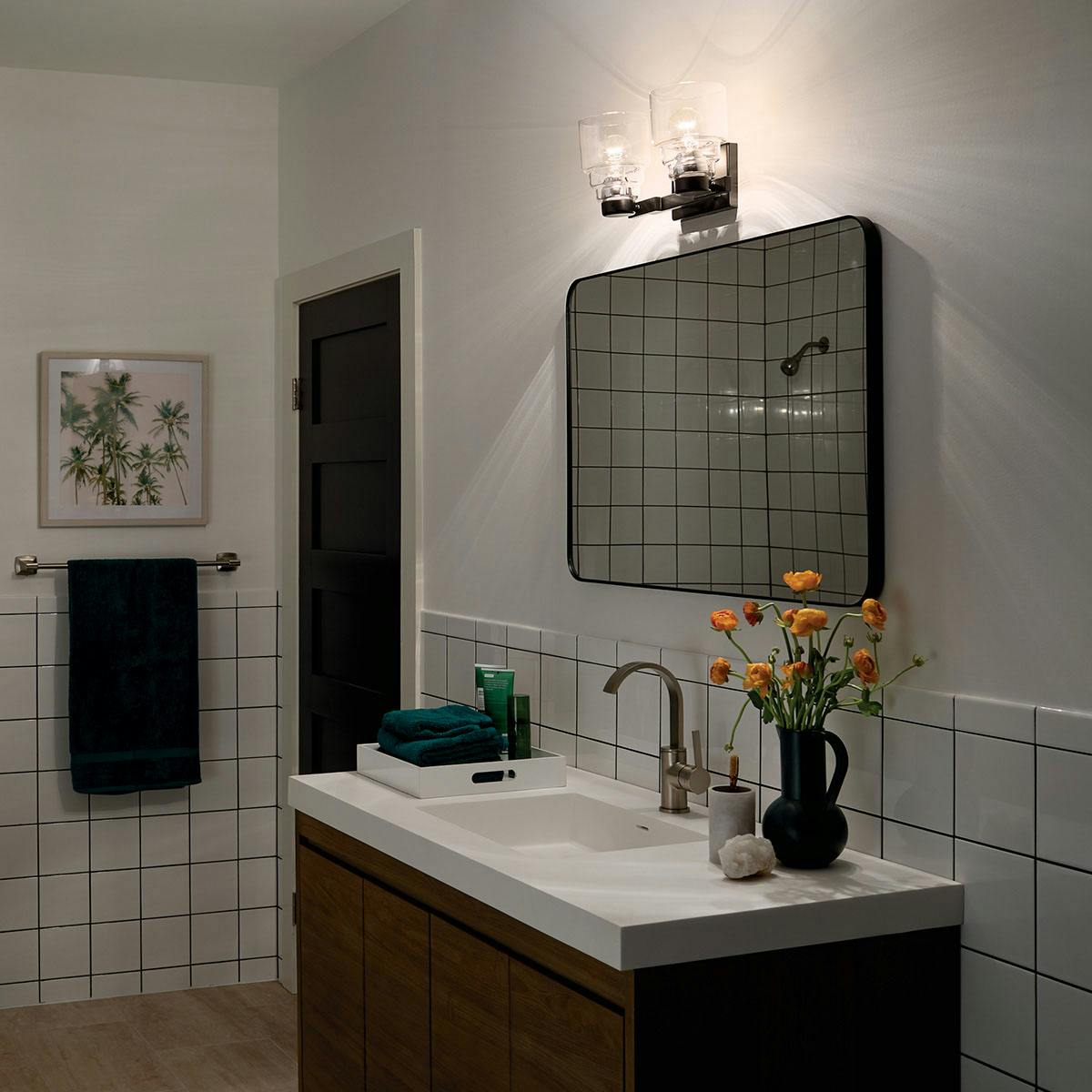 Nighttime Bathroom featuring Vionnet vanity light 55011BK