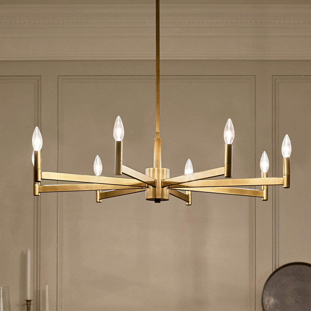 Night time kitchen with Erzo™ 8 Light Chandelier Natural Brass