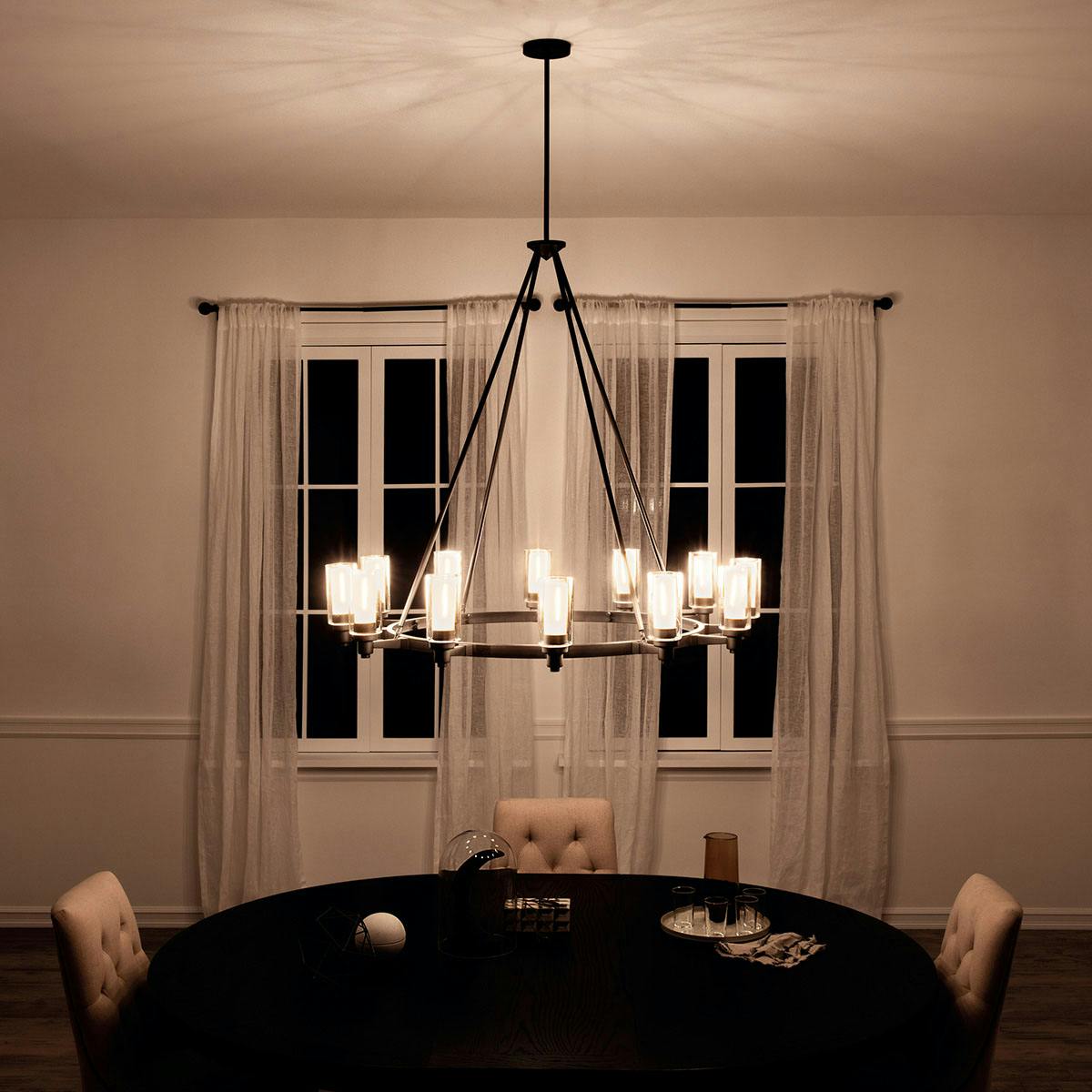 Night time dining room image featuring Circolo chandelier 2347OZ