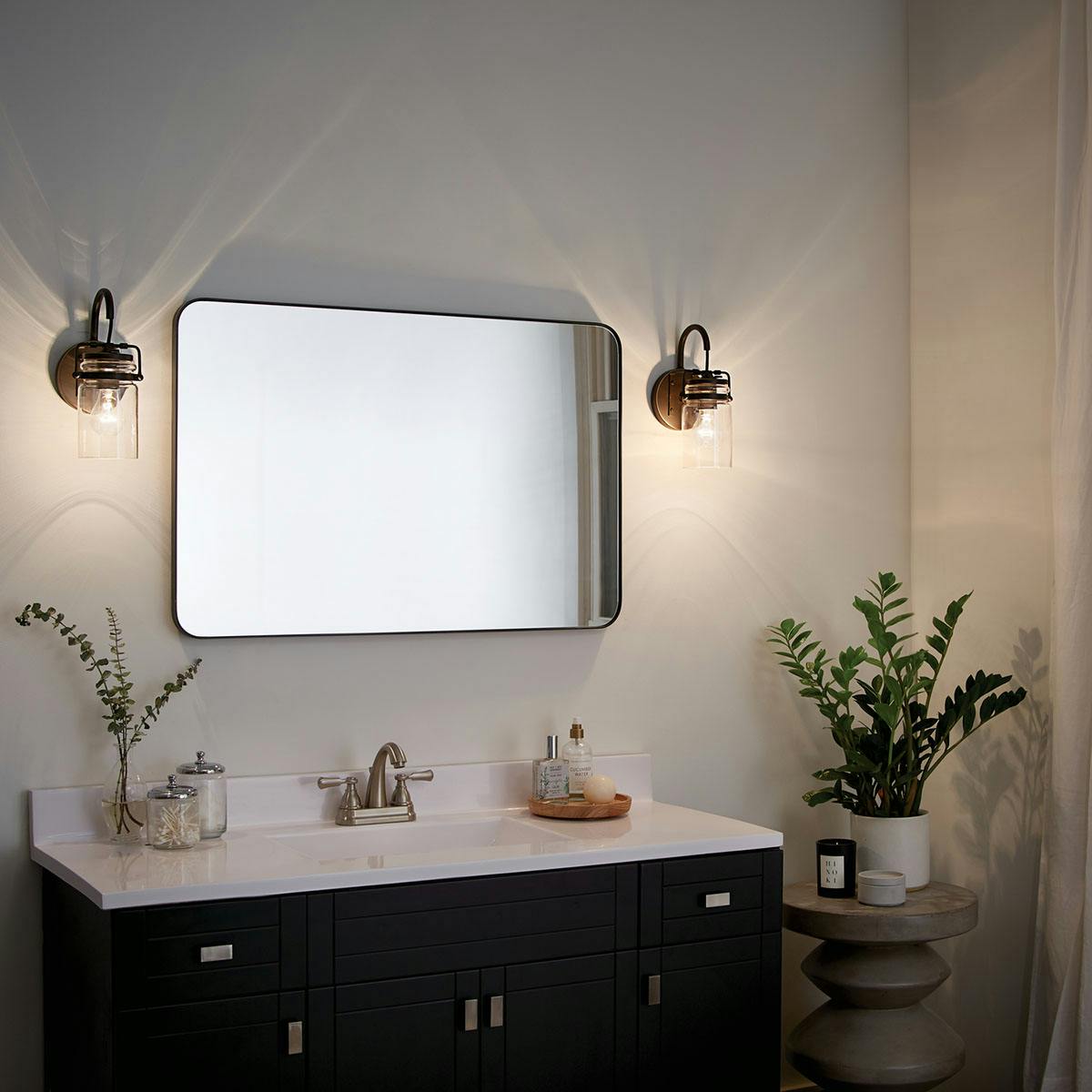 Night time Bathroom featuring Brinley vanity light 45576OZ