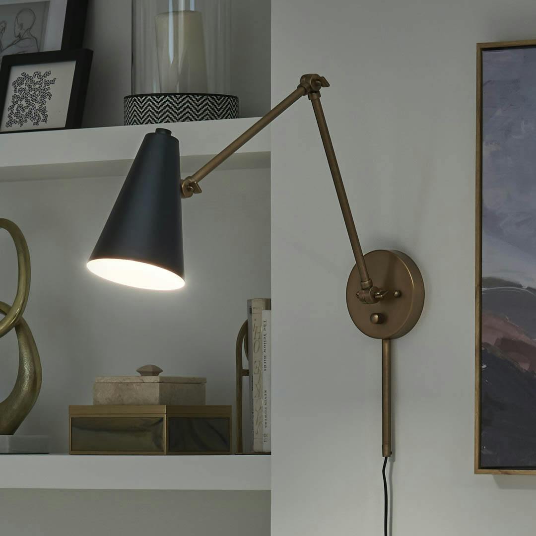 Night time office with Sylvia 1 Light Wall Sconce Natural Brass