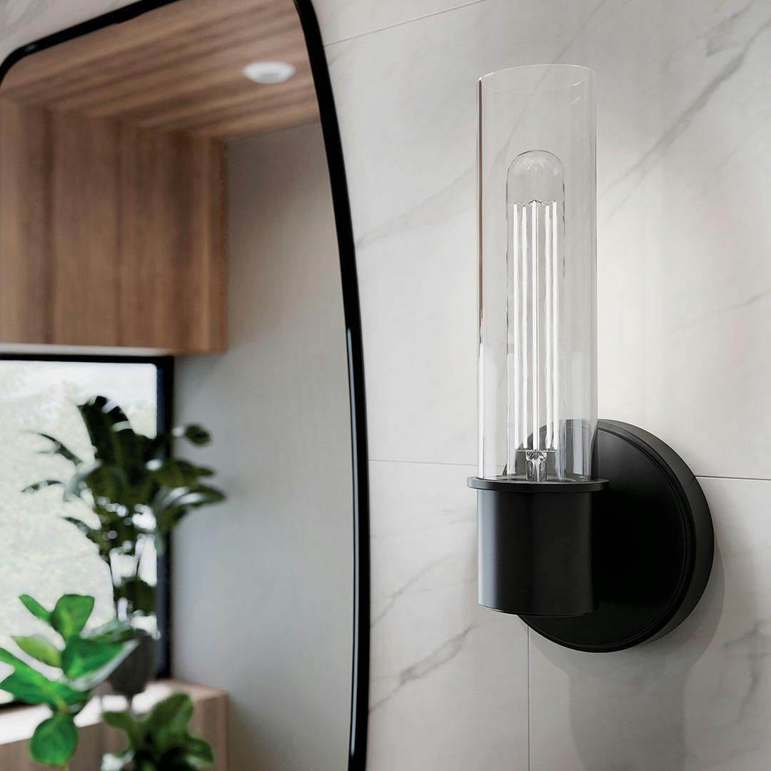 Bathroom in daylight with the Aviv 13 Inch 1 Light Wall Sconce with Clear Glass in Black