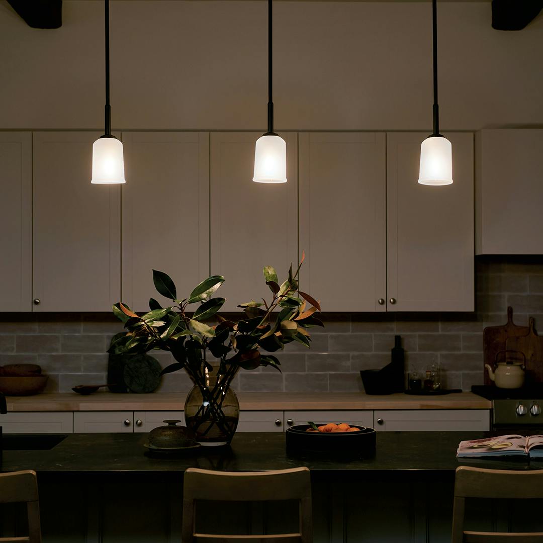 Night time kitchen with Shailene 11.25 inch 1 Light Mini Pendant with Satin Etched Glass in Black