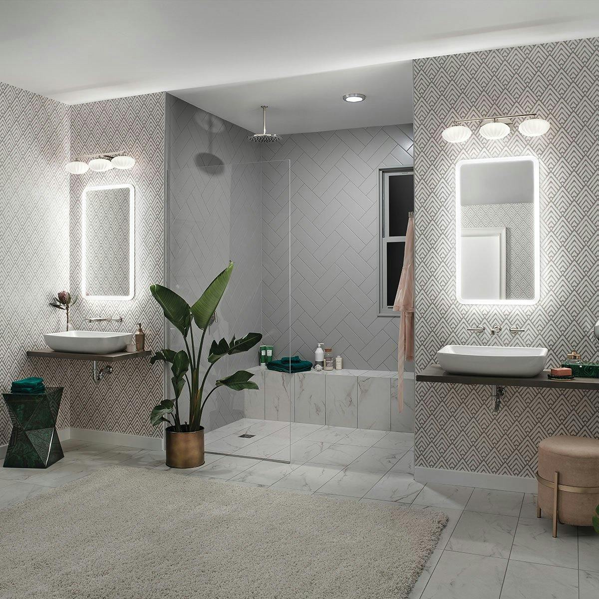 Night time Bathroom featuring Pim vanity light 55025PN