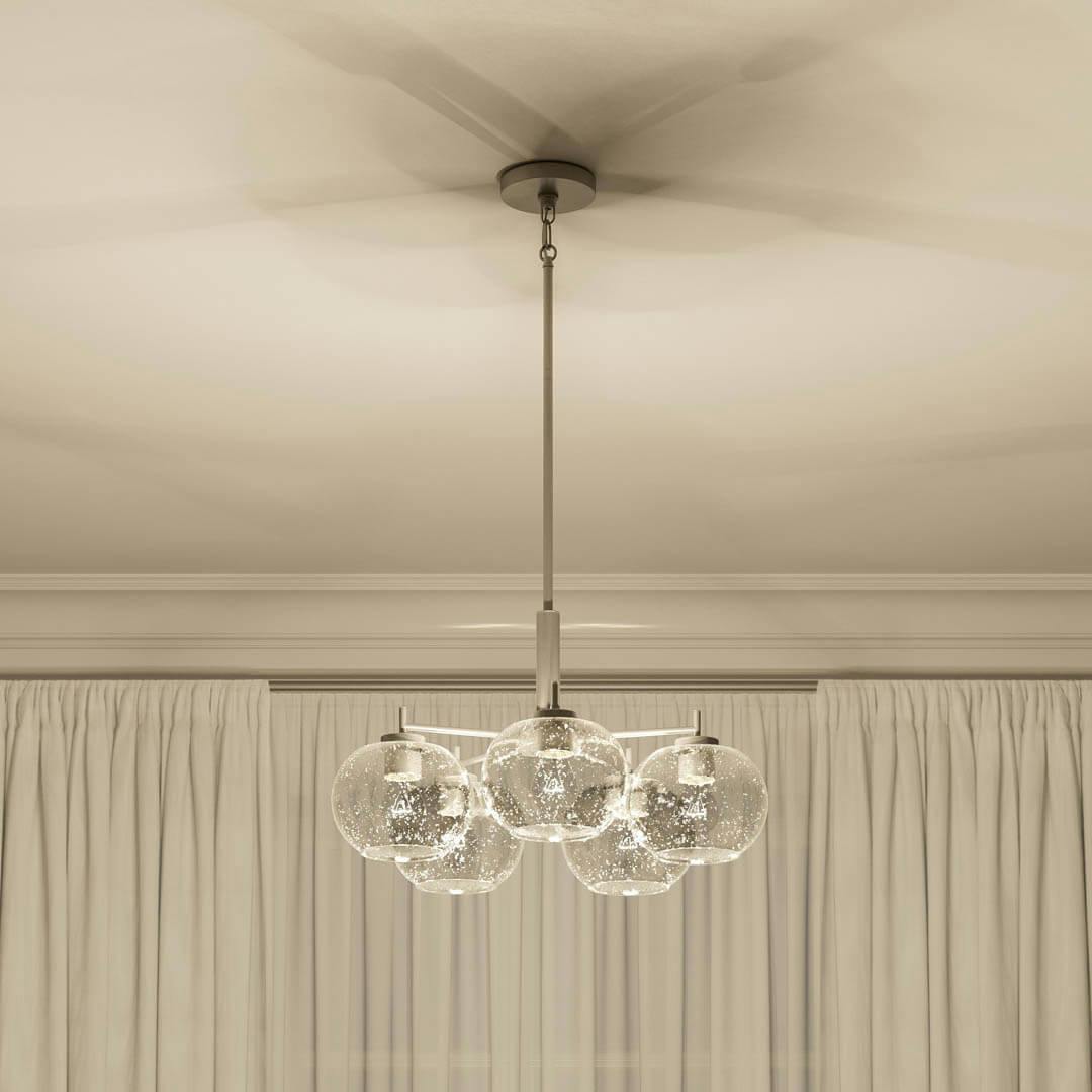 Night time living room with Anamaya 23.5" 5 Light Chandelier Brushed Nickel