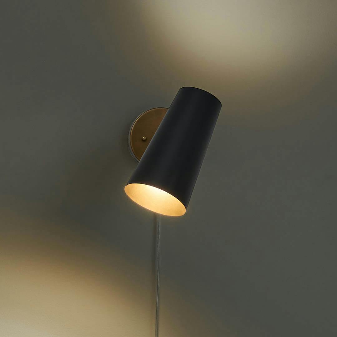 Night time home office with Salema 9 Inch 1 Light  Plug-In Wall Sconce in Natural Brass and Matte Black