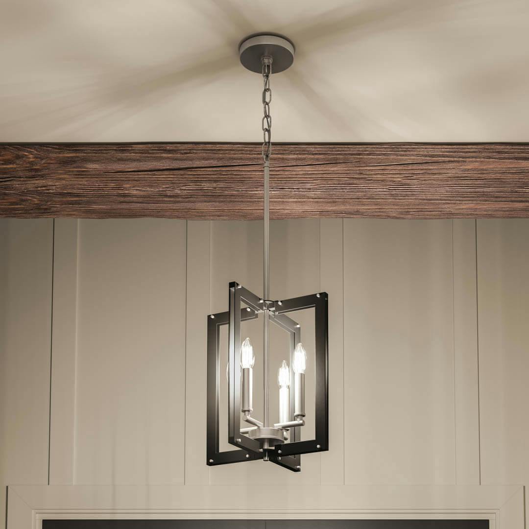 Night time foyer with Pendroy 12" 4 Light Foyer Pendant in Black