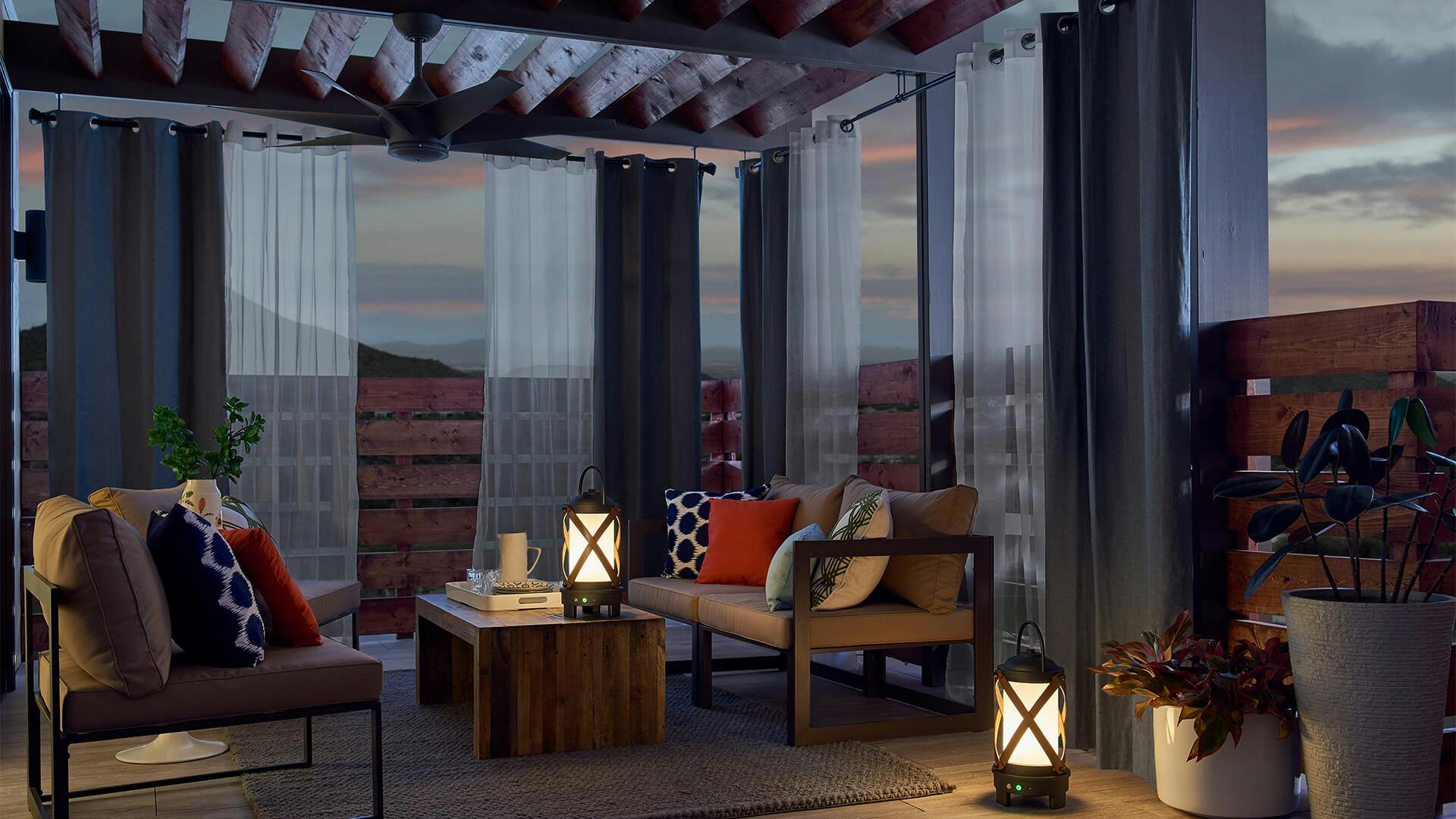 Patio lit by Berryhill lanterns and a Kichler outdoor fan