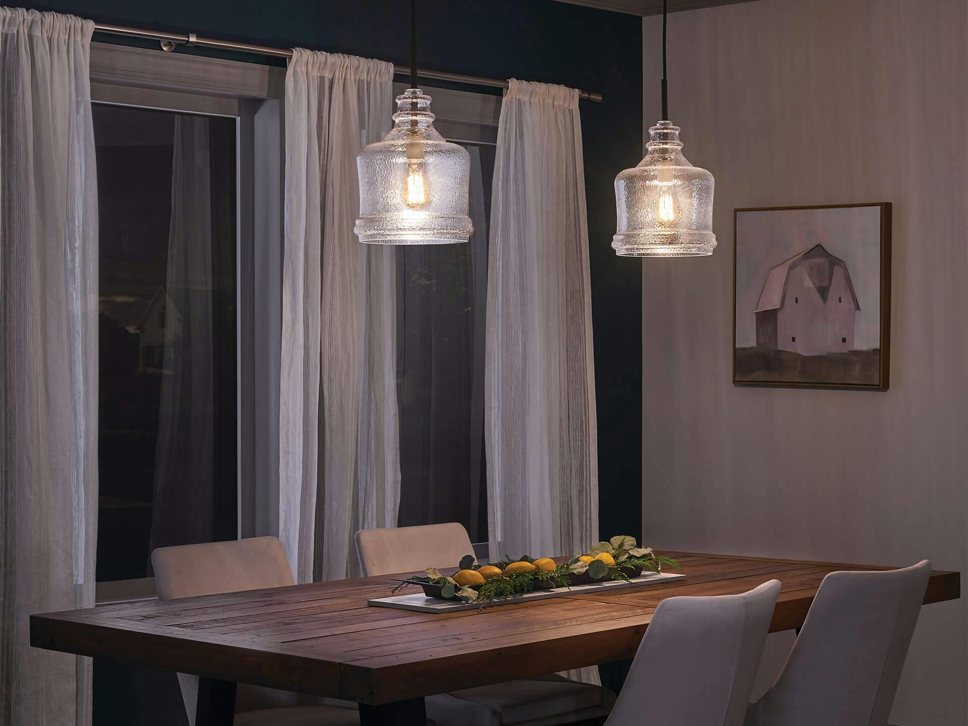 Dining room with two pendant lights hanging above a long table