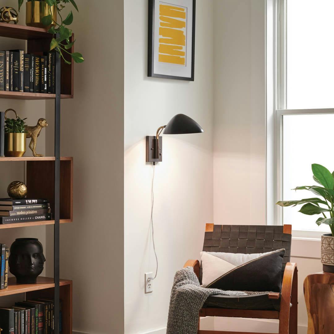 Day time living room with Rico 11.5 Inch 1 Light Plug-In Wall Sconce in Matte Black and Natural Brass