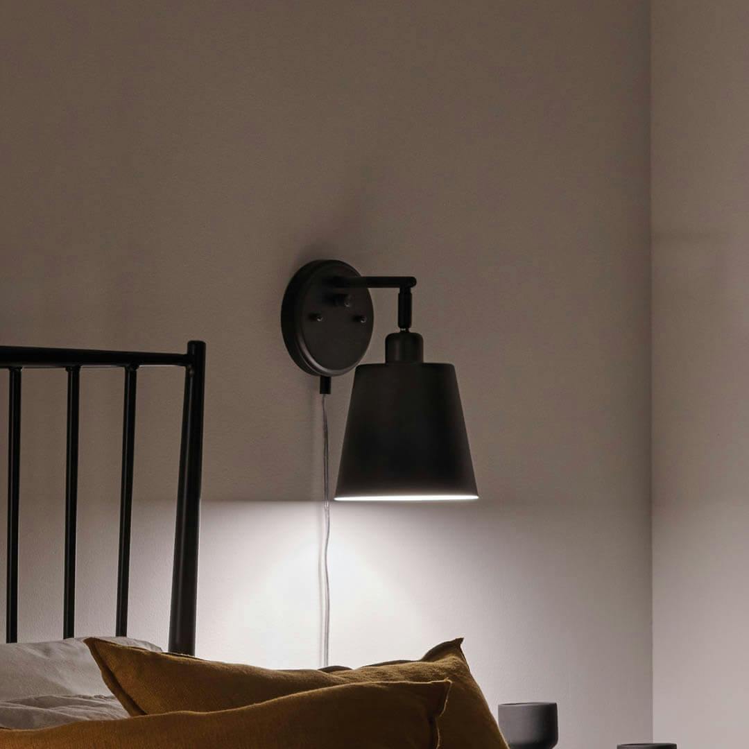 Night time bedroom with Amma 11 Inch 1 Light Plug-In Wall Sconce in Matte Black 