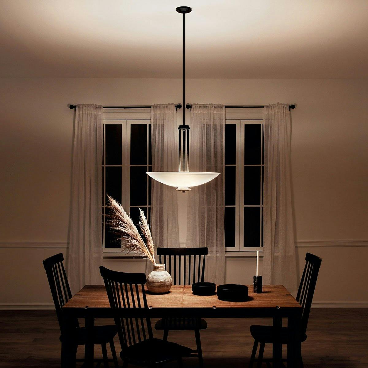 Night time dining room image featuring Hendrik pendant 3275OZ