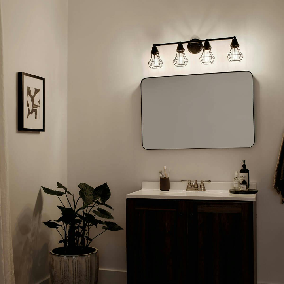Night time Bathroom featuring Bayley vanity light 37508BK
