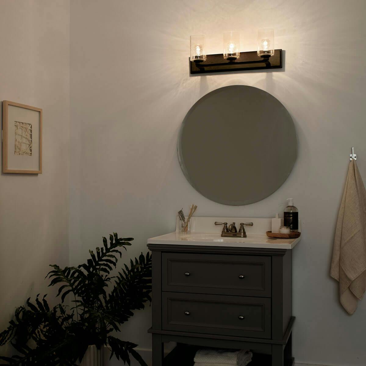 Night time Bathroom featuring Amity vanity light 37490OZ