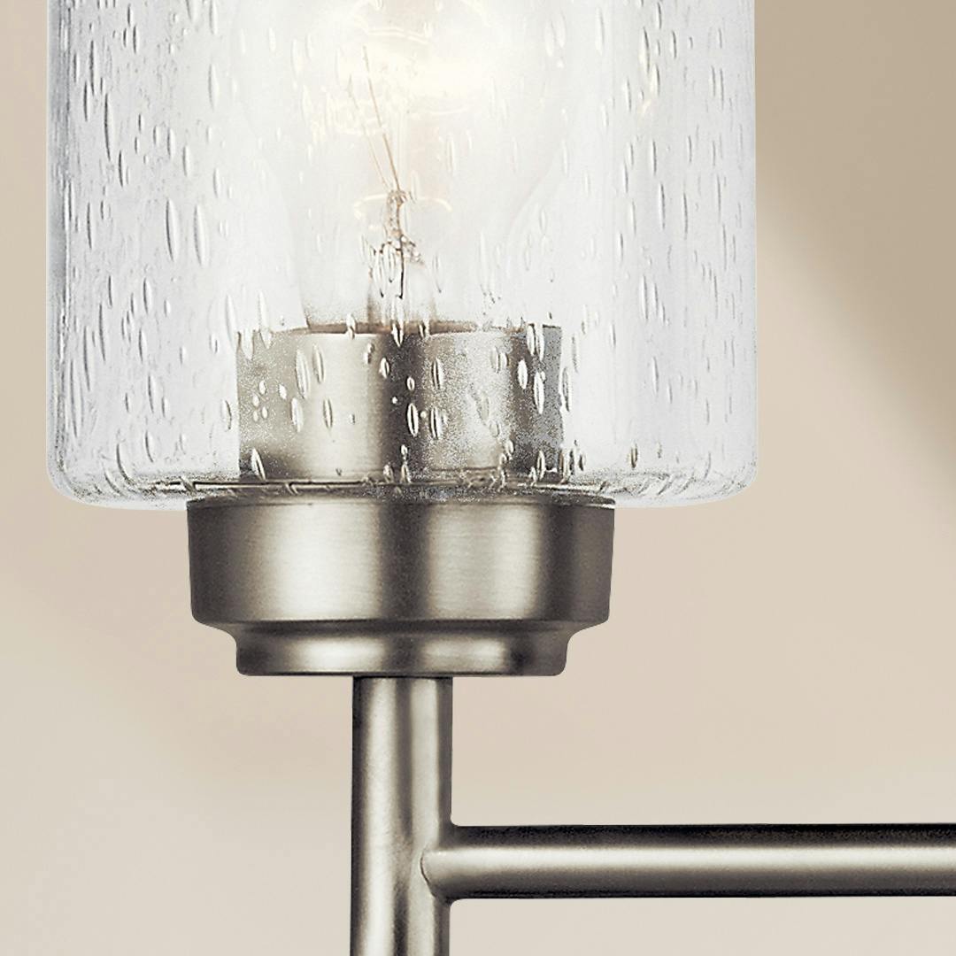 Close up view of the Winslow 30" 4 Light Vanity Light Nickel on a white background