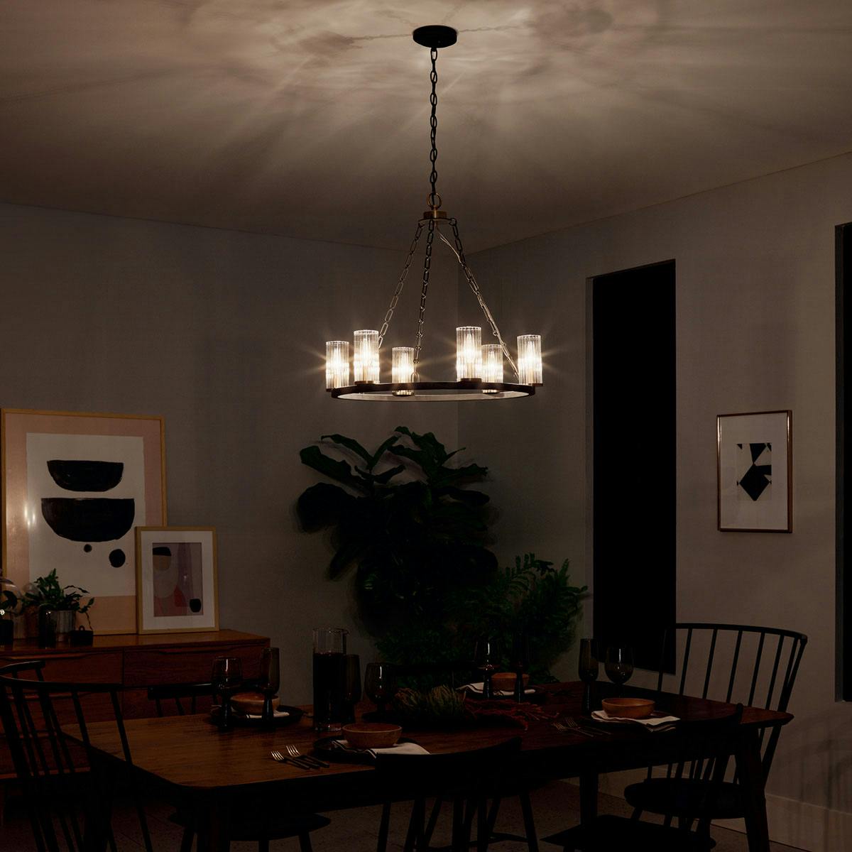 Night time dining room image featuring Mathias chandelier 52107OZ