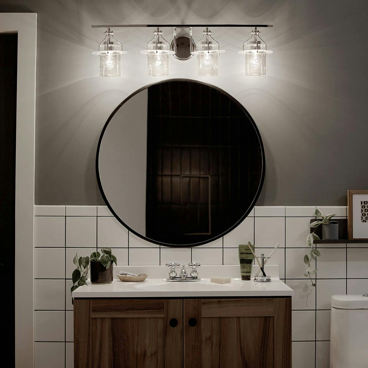 Night time Bathroom image featuring Everett vanity light 55080PN