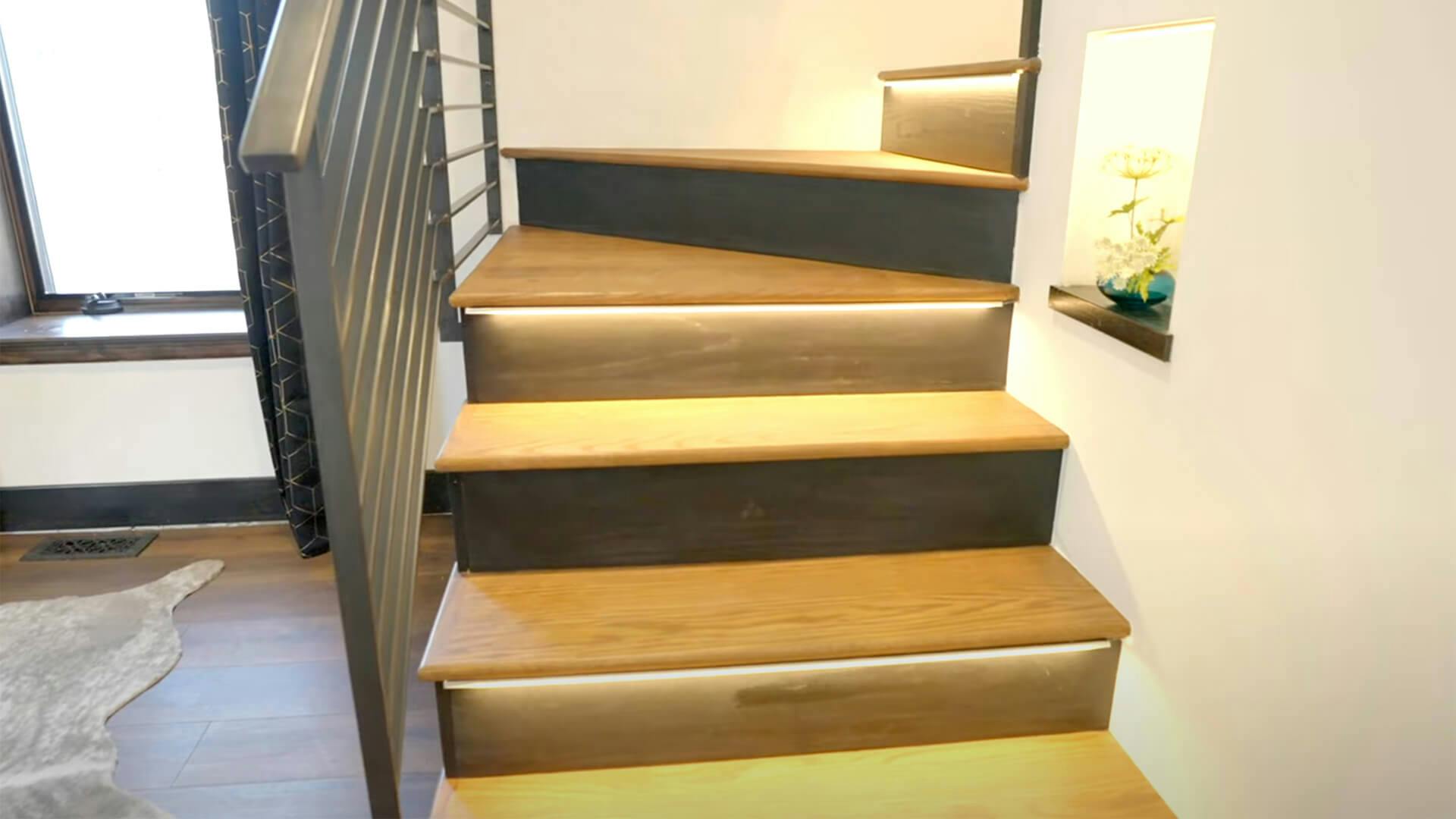Wooden stairs with lights under each step