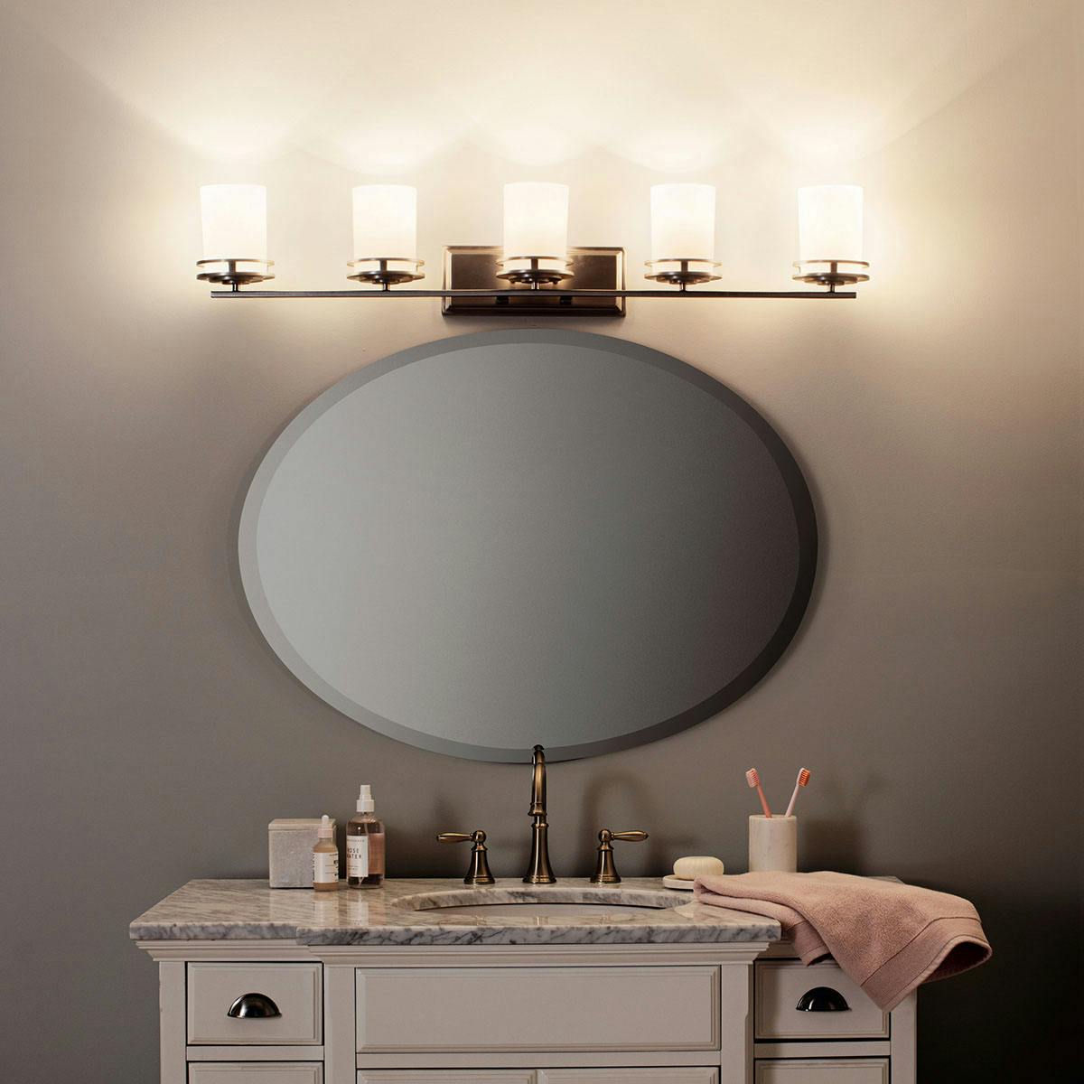 Night time Bathroom featuring Hendrick vanity light 5085NI