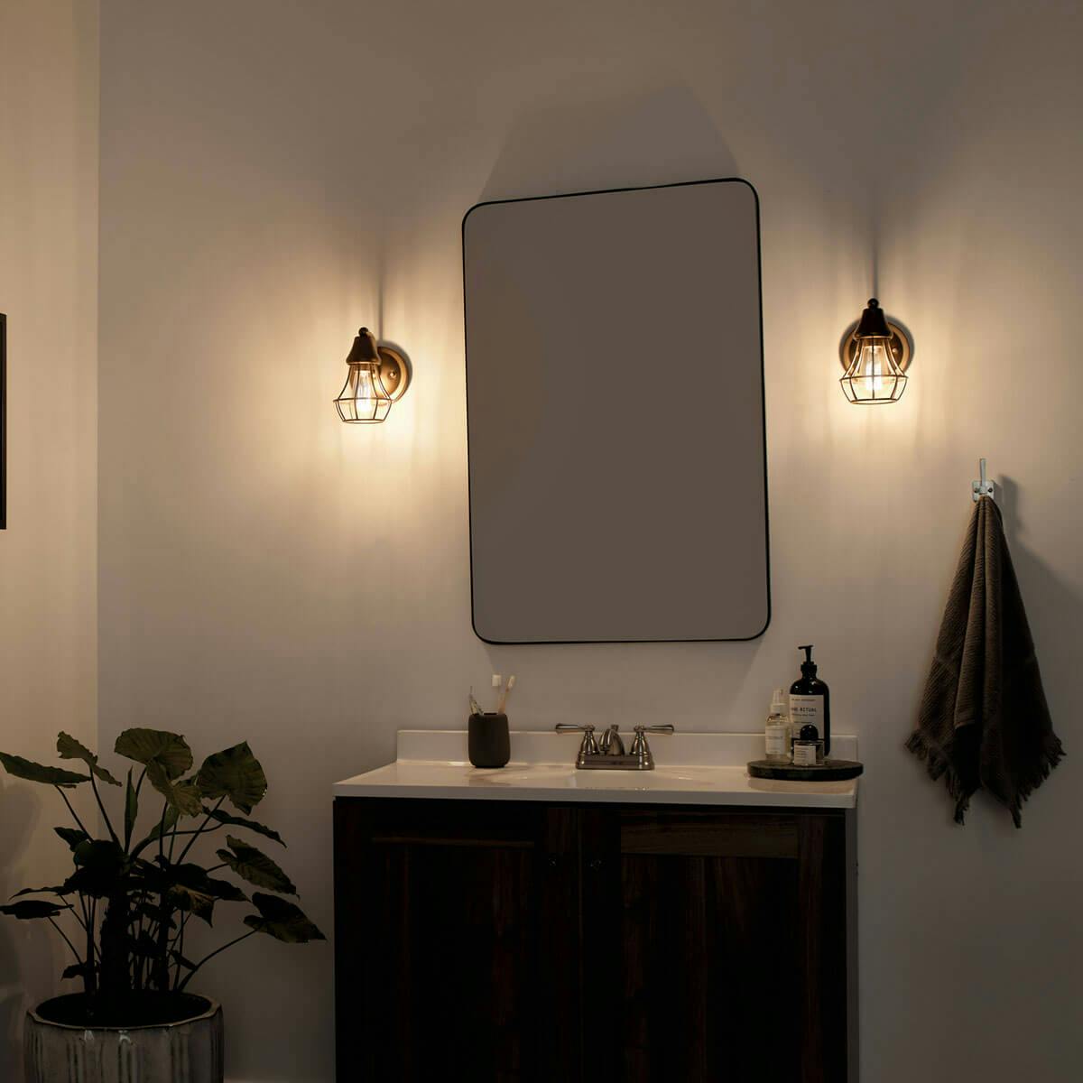Night time Bathroom featuring Bayley vanity light 37511NBR