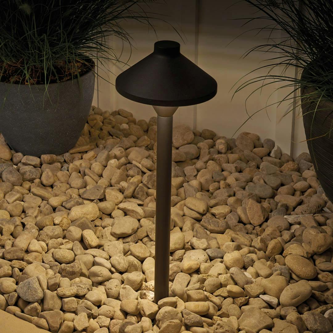 Night time outdoors with 12V Adjustable Drop-In LED Path and Spread Light Kit in Textured Black